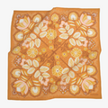 Floral patterned fabric on an orange background