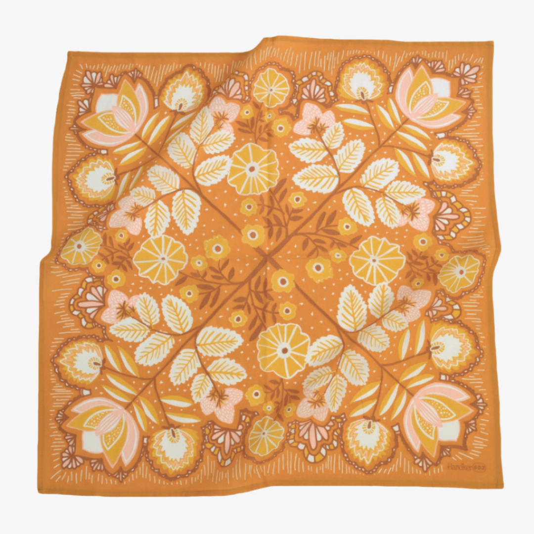 Floral patterned fabric on an orange background