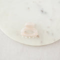 pink hair clip on a white background
