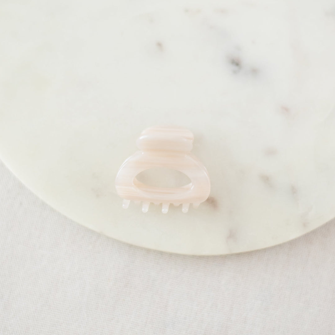 pink hair clip on a white background