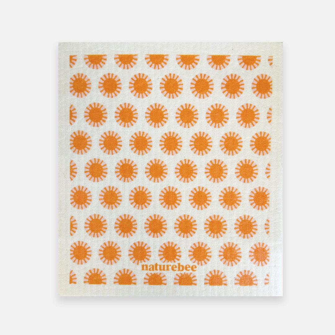 White towel with orange sun pattern and 'Naturebee' branding on a white background