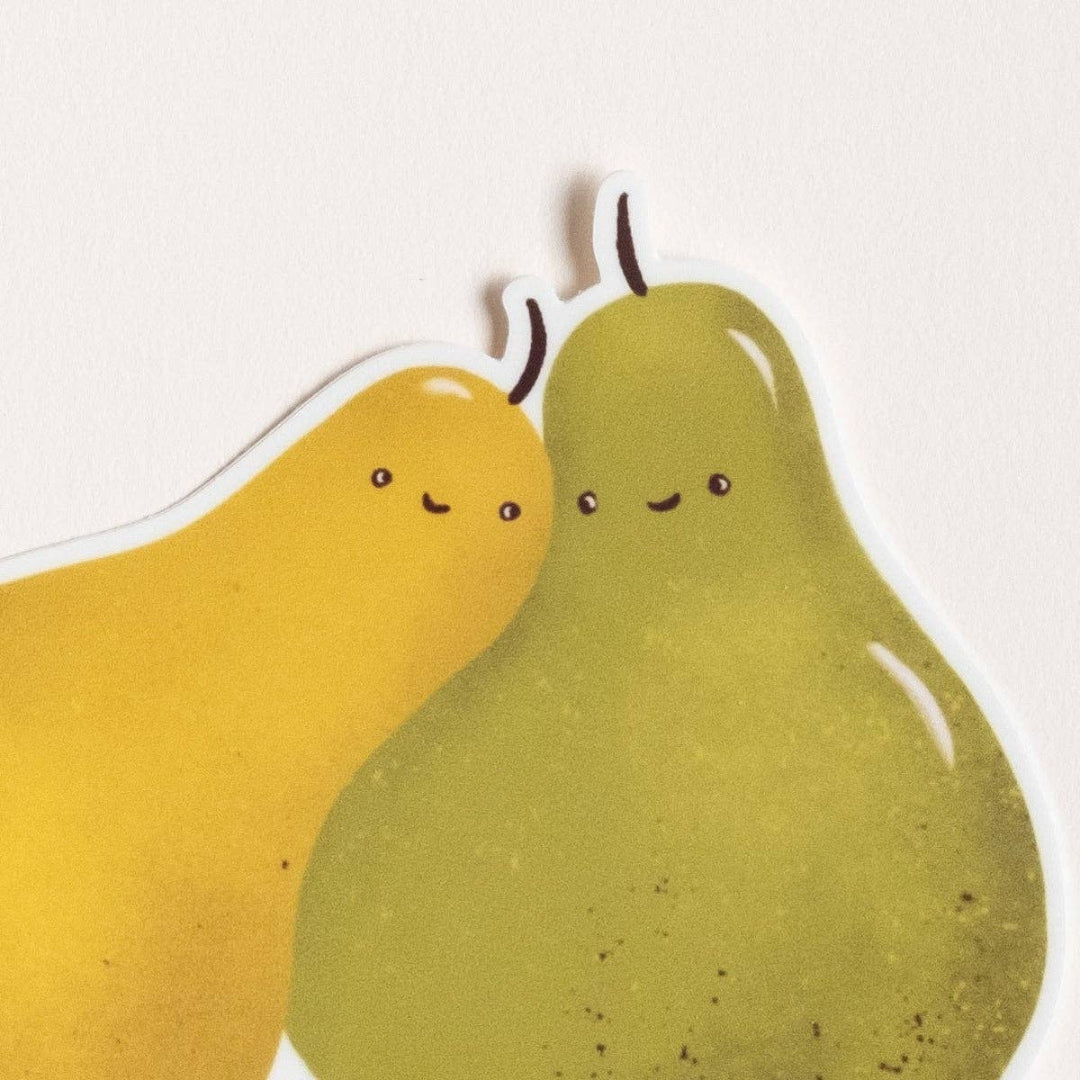 Two cartoon pears with smiling faces on a white background