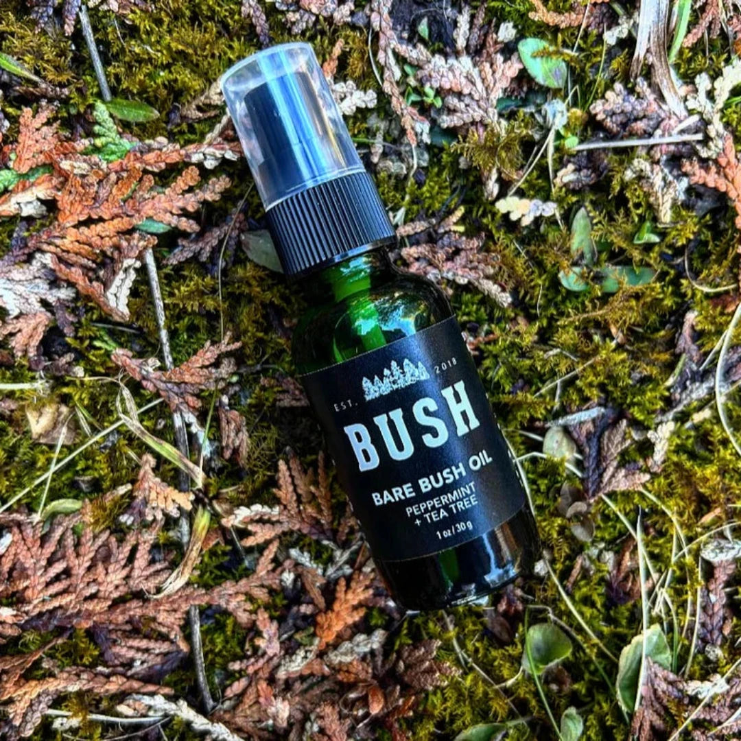 Peppermint & Tea Tree Bare Bush After-Shave a soothing after shave oil in a green spray bottle.