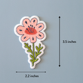 Floral patch with dimensions on a gray background