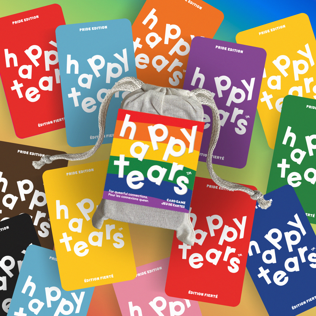Pride conversation cards. Grey drawstring bag, multicoloured cards. Cards: 'happy tears', rainbow design. Bag text: 'For queerful connections', 'Pour les connexions queer'.