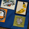 Collection of patches on a blue fabric background