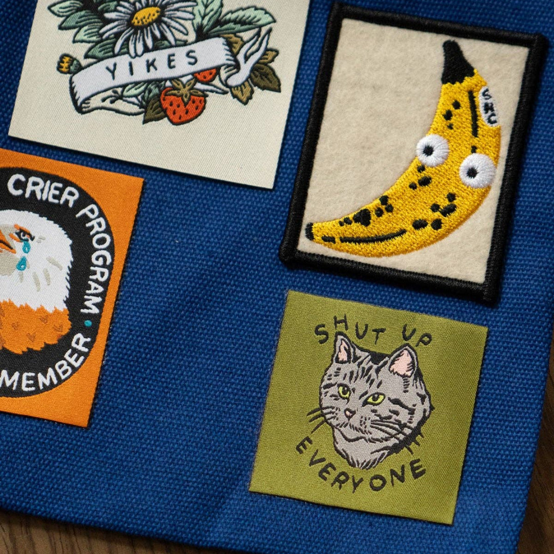 Collection of patches on a blue fabric background