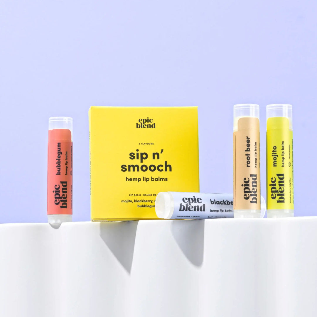 A 4-pack of Epic Blend "Sip n' Smooch" hemp lip balms, featuring Mojito, Root Beer, Blackberry, and Bubblegum flavors, displayed next to their yellow packaging box.