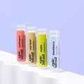 A 4-pack of Epic Blend "Sip n' Smooch" hemp lip balms, featuring Mojito, Root Beer, Blackberry, and Bubblegum flavors, displayed next to their yellow packaging box.