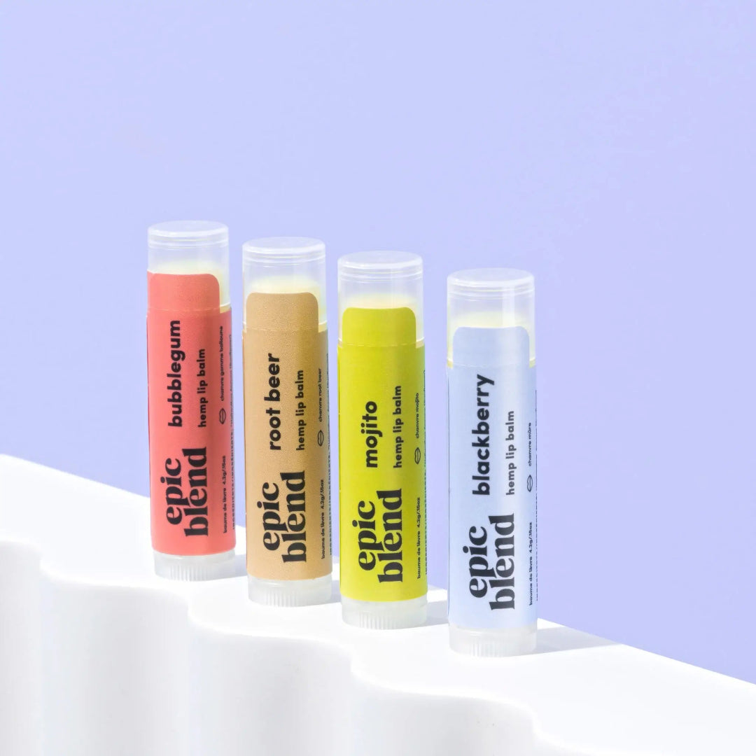 A 4-pack of Epic Blend "Sip n' Smooch" hemp lip balms, featuring Mojito, Root Beer, Blackberry, and Bubblegum flavors, displayed next to their yellow packaging box.