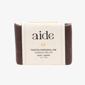 Bar of soap with 'aide' branding on a white background