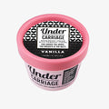 Pink container of Under Carriage deodorant cream with black and white label on a white background