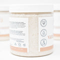 Jar of bath salts with a label on a white background