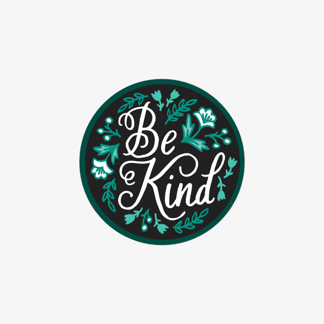 Circular sticker with 'Be Kind' text and decorative elements on a white background