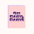 A pink greeting card with a light purple envelope. The card features the text "OH BABY, BABY!" in bold, navy blue, and slightly overlapping letters with a 3D effect.
