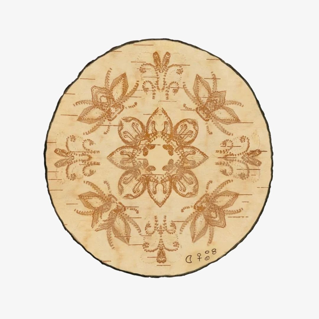 The Birch Bark Reversible Blanket by Mini Tipi, featuring a delicate white birch bark-inspired pattern on a grey background, hanging from a wooden rod. This reversible blanket is available in Ottawa, Ontario, Canada.