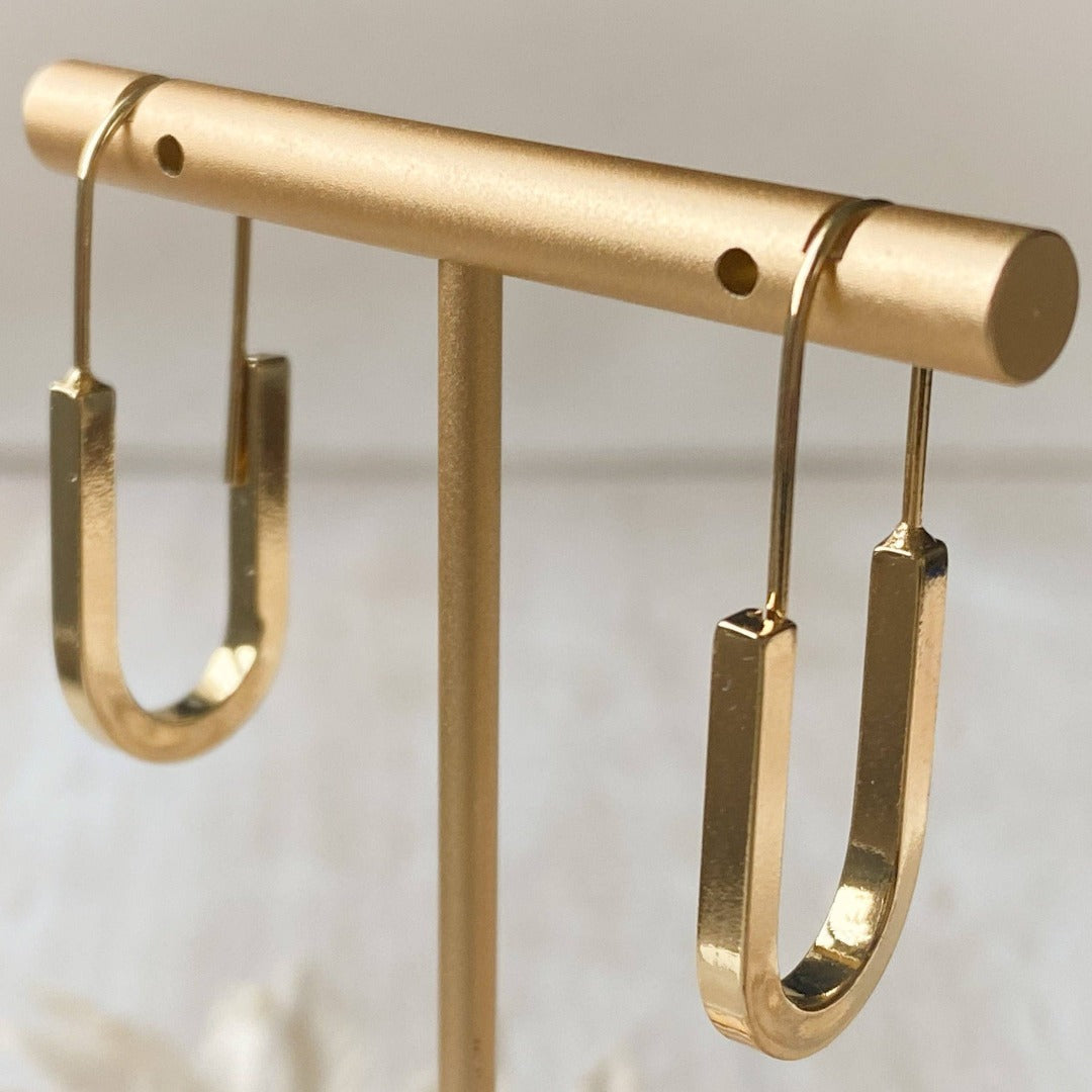 The Gold Minimalist Hoop is an ultra modern and sleek design and will be sure to keep you looking top notch. Nickel free and 14K gold plated.  Made in Canada. Close Up product image