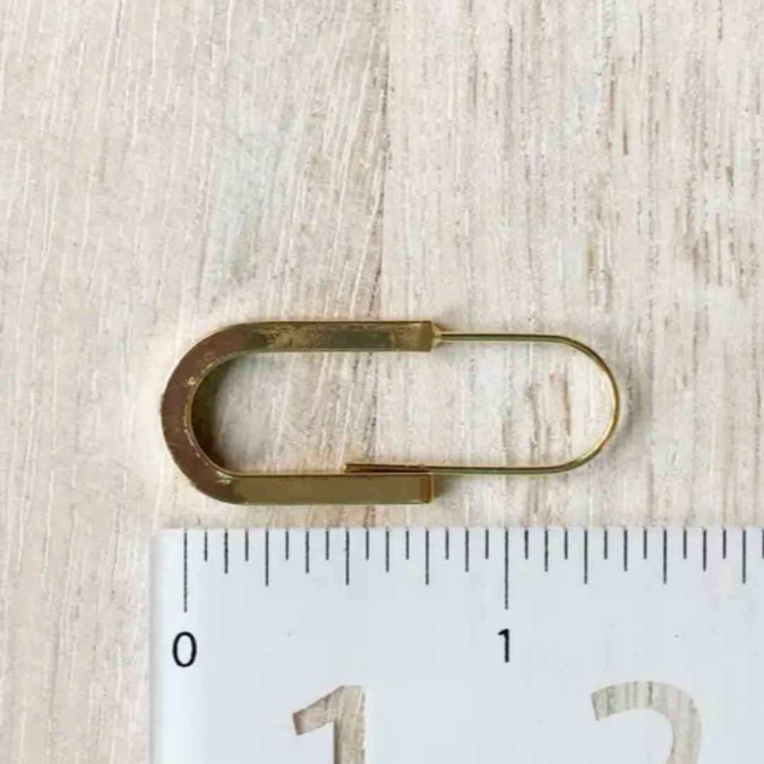 The Gold Minimalist Hoop is an ultra modern and sleek design and will be sure to keep you looking top notch. Nickel free and 14K gold plated.  Made in Canada. Close Up product image