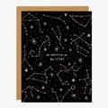A black card with pink and white star constellations and quote "it's written in the stars".