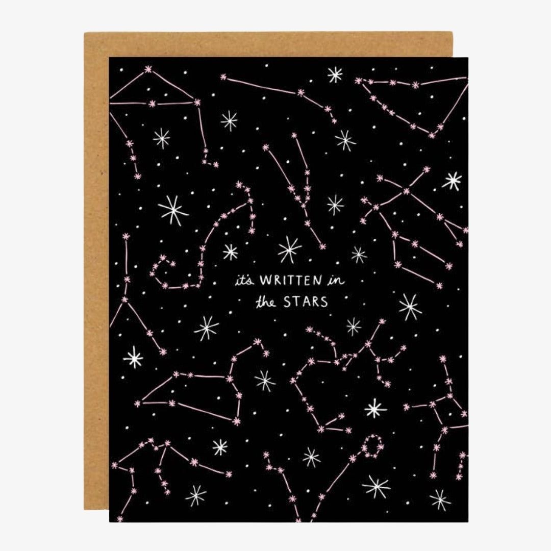 A black card with pink and white star constellations and quote "it's written in the stars".