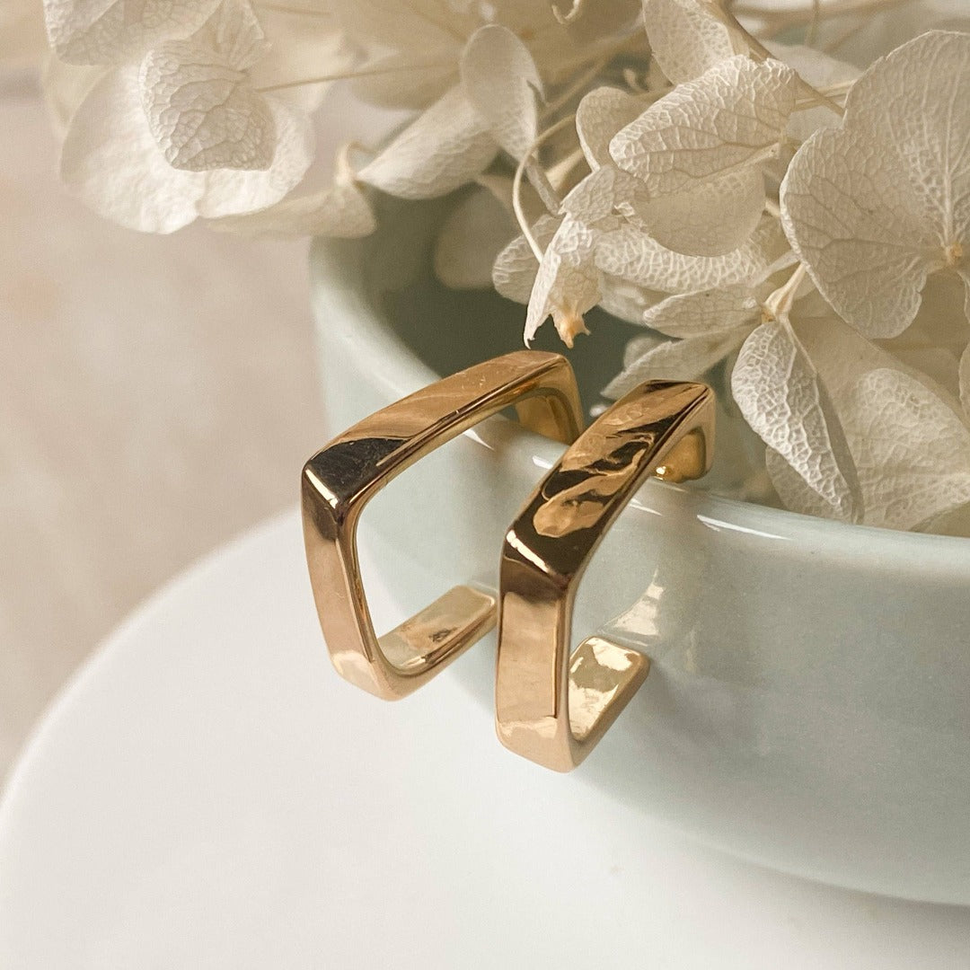 The Gold Squared Hoops are 18K gold plated with a stainless steel post that is nickel free product close up