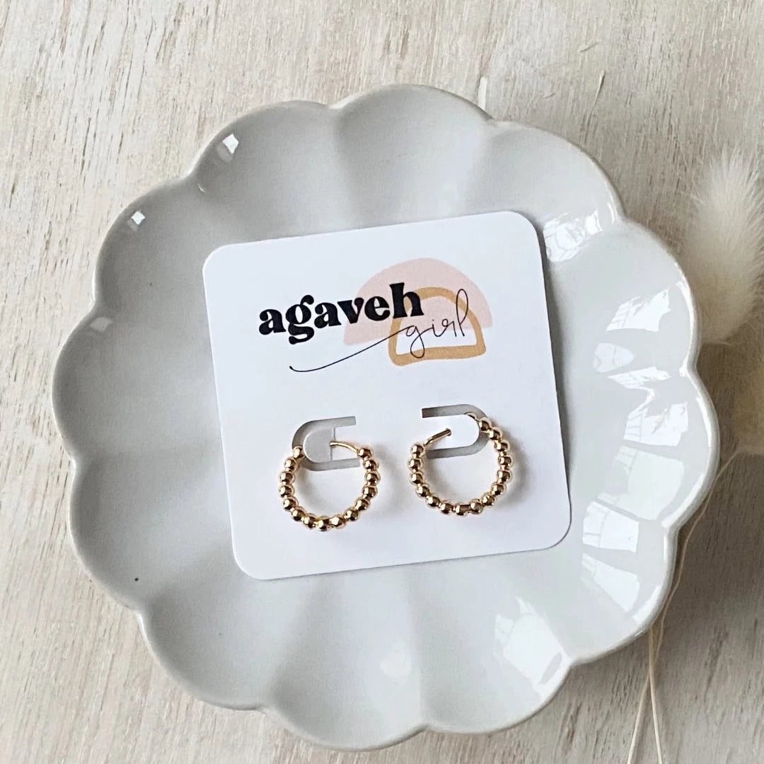 Gold Beaded Hoops. Gold hoop earrings made from gold beads connected into a circle.