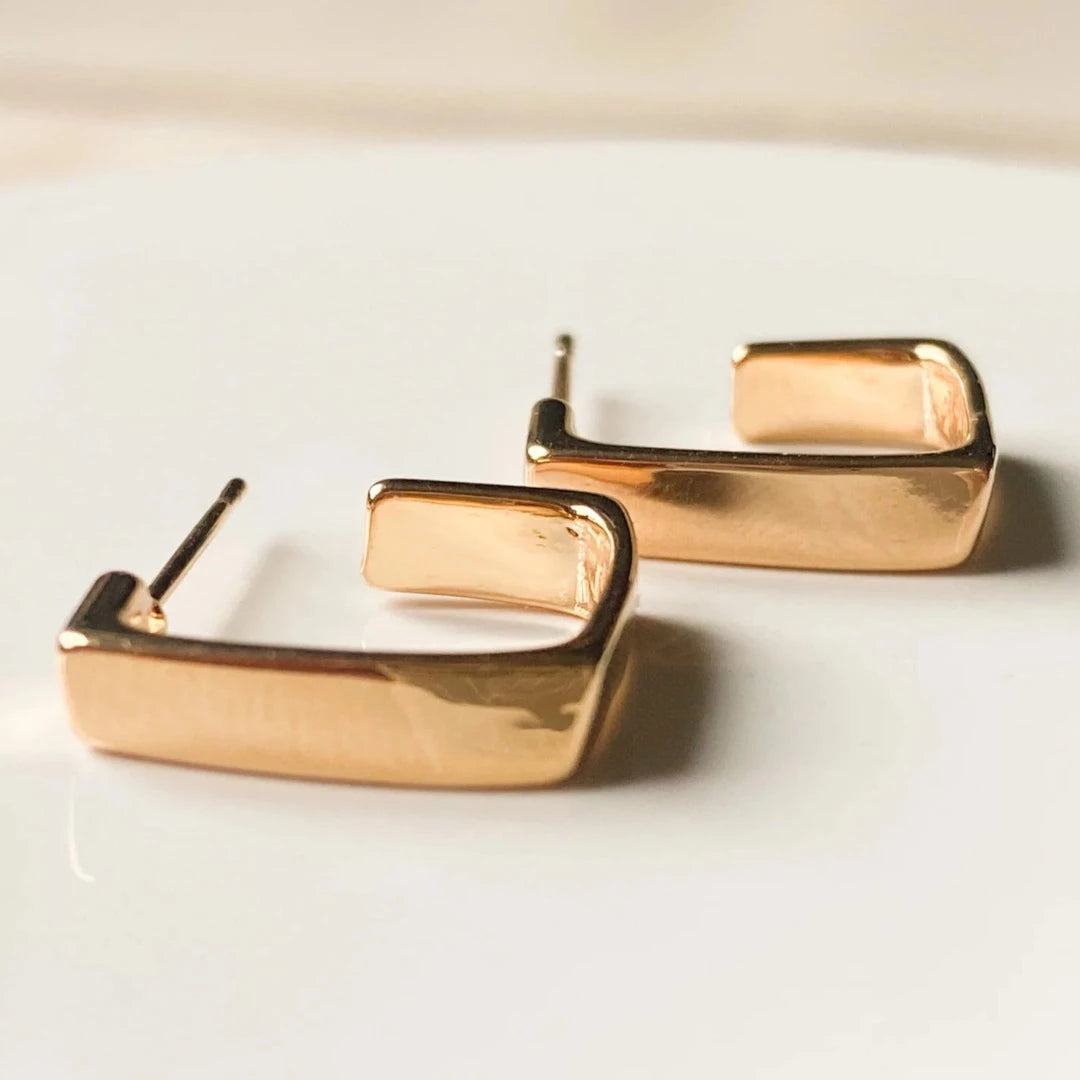 The Gold Squared Hoops are 18K gold plated with a stainless steel post that is nickel free Product Close up