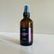 Lavender Magic Magnesium Spray, a body spray for sleep, chronic pain and anxiety in an amber bottle with a black sprayer.