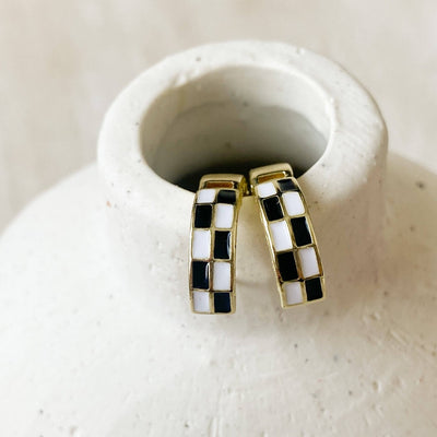 Gold Checkered Hoops, hoop earrings in gold with a black and white checkerboard pattern on the front.