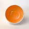 Orange Colourful Trinket Dish, a small bowls with colour on the inside and speckled cream coloured clay on the outside.