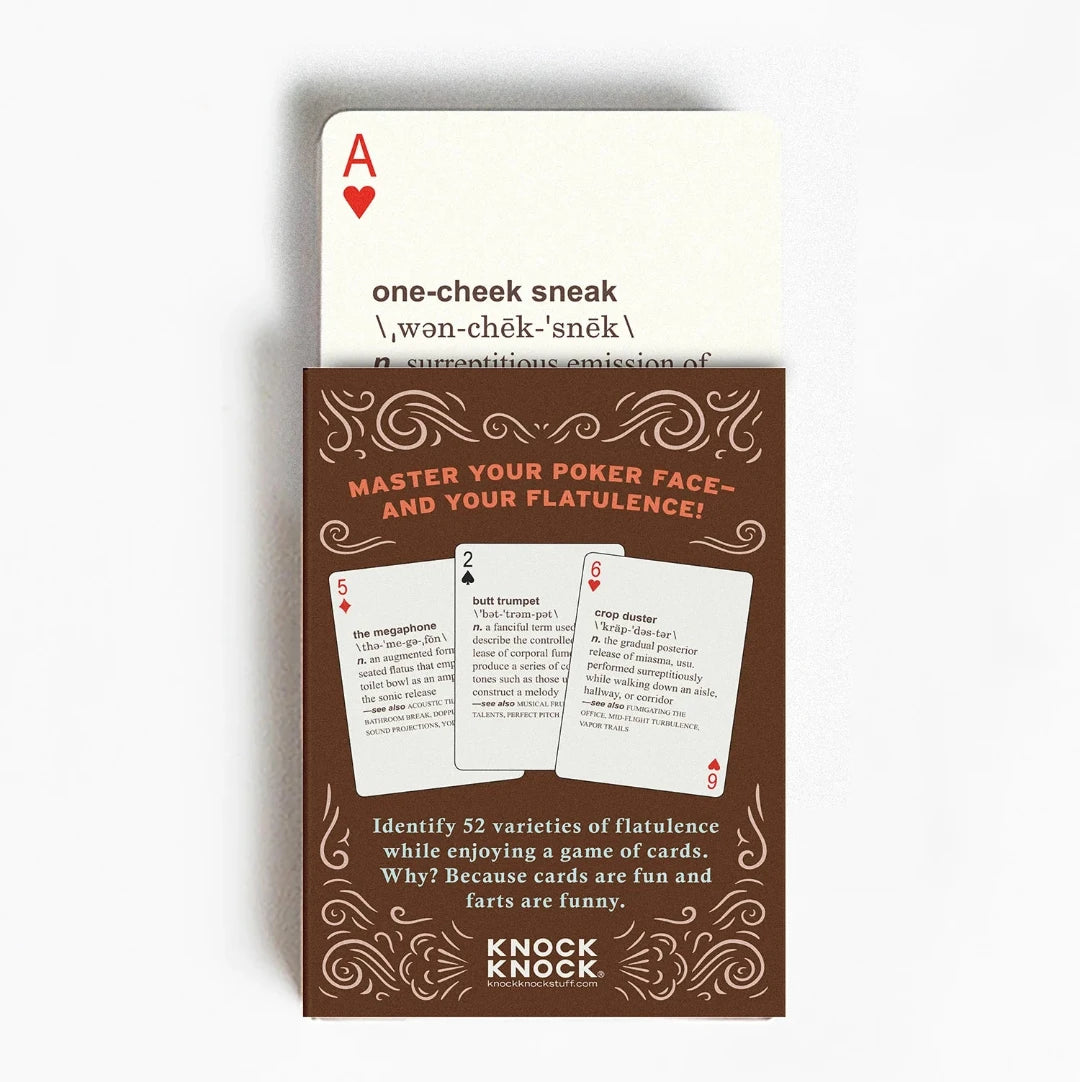 A deck of playing cards with a brown background and a cartoon illustration of a dog passing gas. The deck is enclosed in a cardboard box with the text "52 FARTS PLAYING CARDS" and "A Deck of Cards That Also Defines Every Type of Gas Ever Passed." The box also has the text "Know When to Hold 'Em - and When to Let 'Em Rip!"