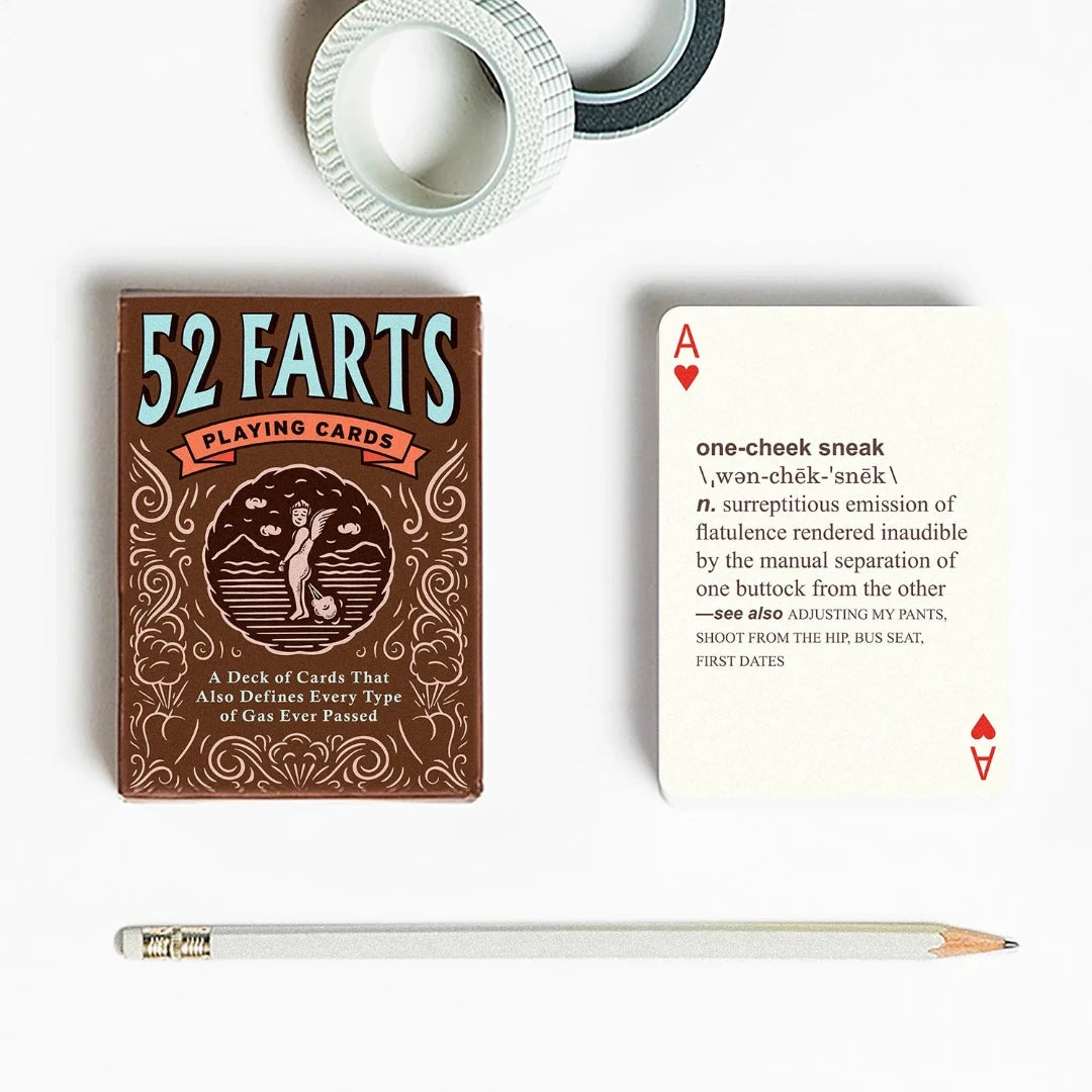 A deck of playing cards with a brown background and a cartoon illustration of a dog passing gas. The deck is enclosed in a cardboard box with the text "52 FARTS PLAYING CARDS" and "A Deck of Cards That Also Defines Every Type of Gas Ever Passed." The box also has the text "Know When to Hold 'Em - and When to Let 'Em Rip!"