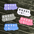 Five stickers with '54321' design on a textured surface