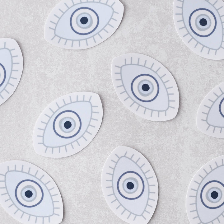 Evil Eye Sticker, a white sticker with a blue evil eye.