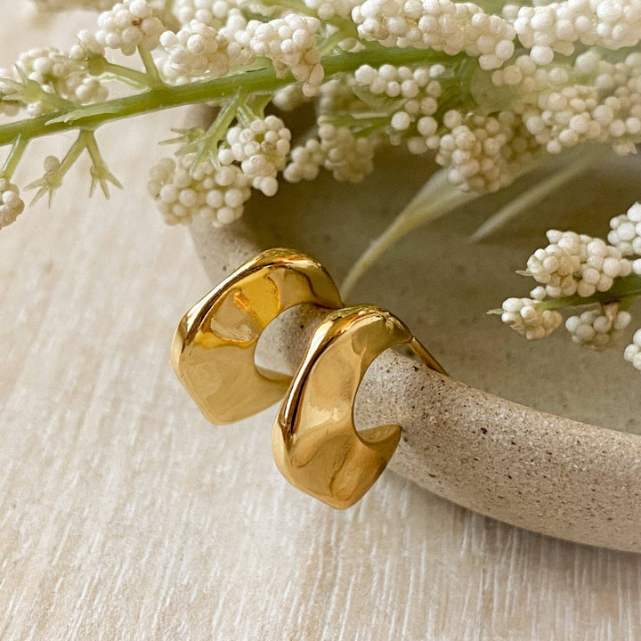 Gold Alli Hoops, gold post earrings in an organic chunky hoop shape.