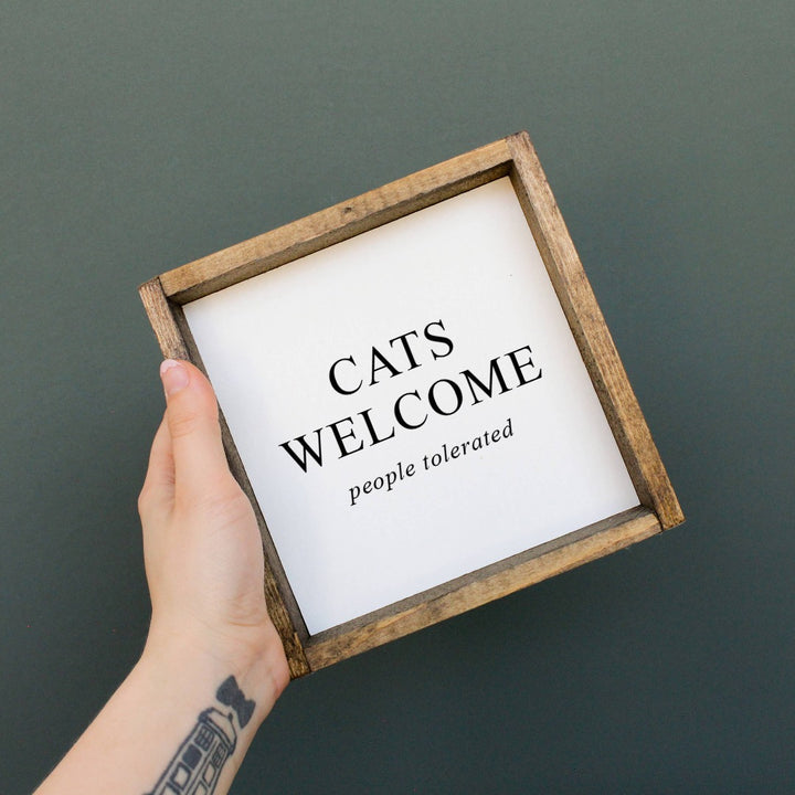 A white framed box sign with the text 