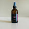 Lavender Magic Magnesium Spray, a body spray for sleep, chronic pain and anxiety in an amber bottle with a black sprayer.