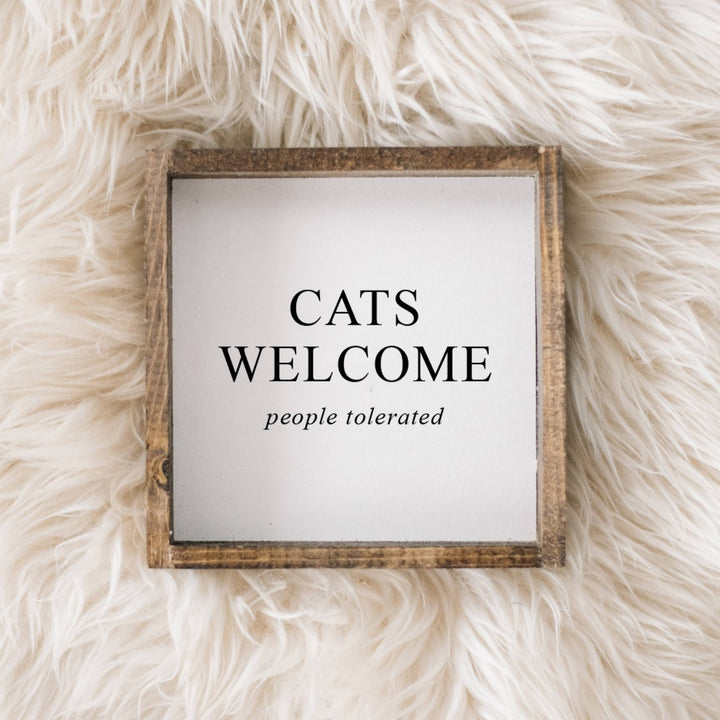 A white framed box sign with the text 