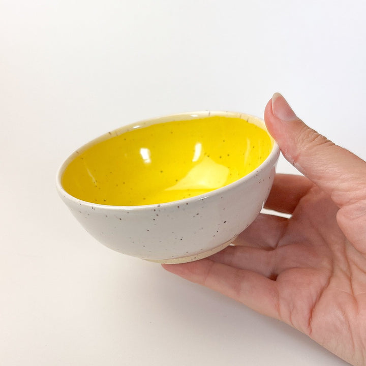 Yellow Colourful Trinket Dish, a small bowls with colour on the inside and speckled cream coloured clay on the outside.