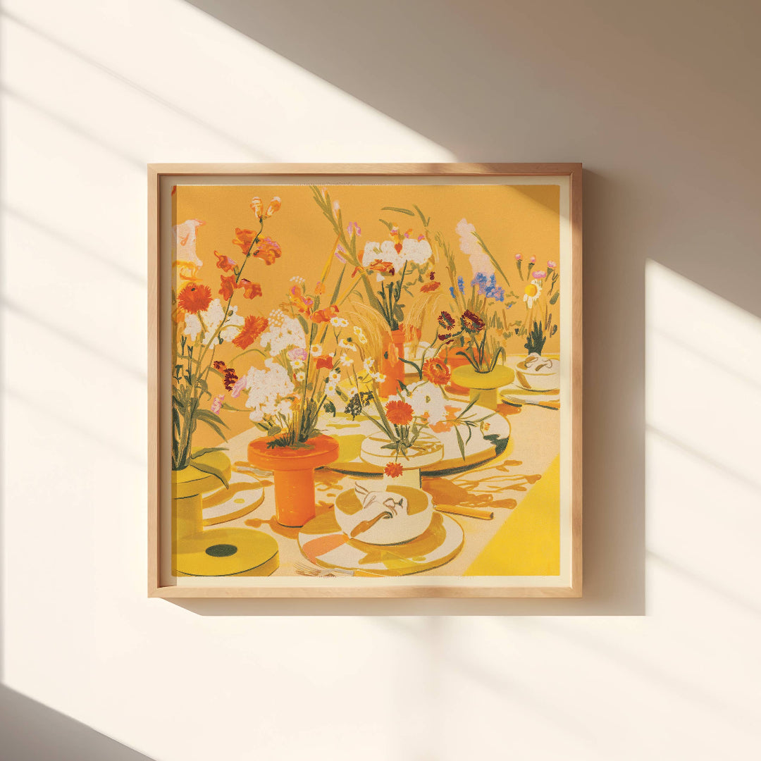 Framed artwork of a still life scene with flowers and tableware on a wall with sunlight casting shadows.