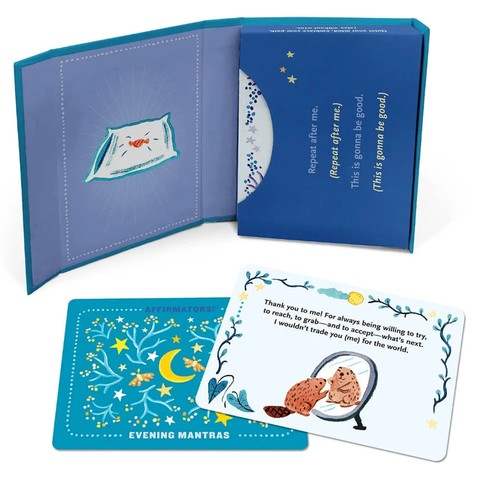 A pink box containing a deck of affirmation cards. The box has the text 