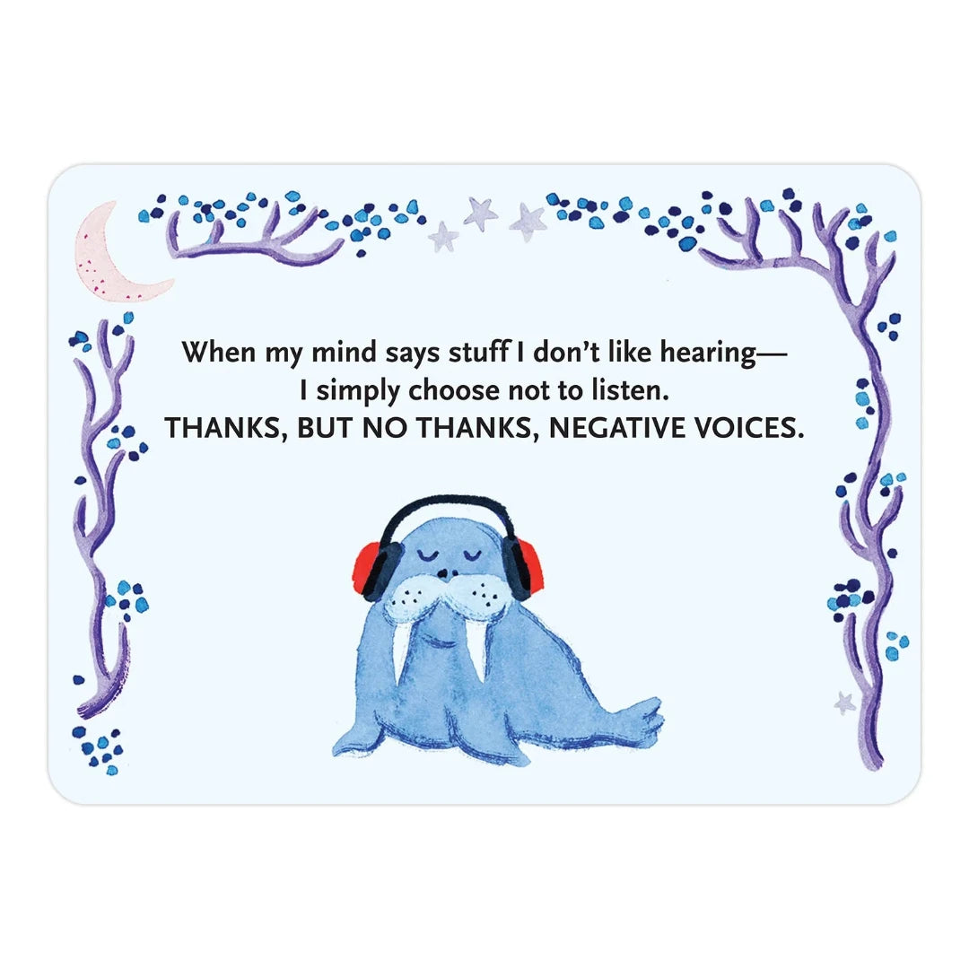 A pink box containing a deck of affirmation cards. The box has the text "AFFIRMATORS! EVENING MANTRAS" on the front. The cards have various affirmations printed on them, including "Let Go, Unwind, and Help Yourself Without the Self-Helpy-Ness!" and "Thank you to me! For always being willing to try, what's next." The box also includes a small booklet with additional affirmations.