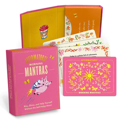 A pink box containing a deck of affirmation cards. The box has the text 