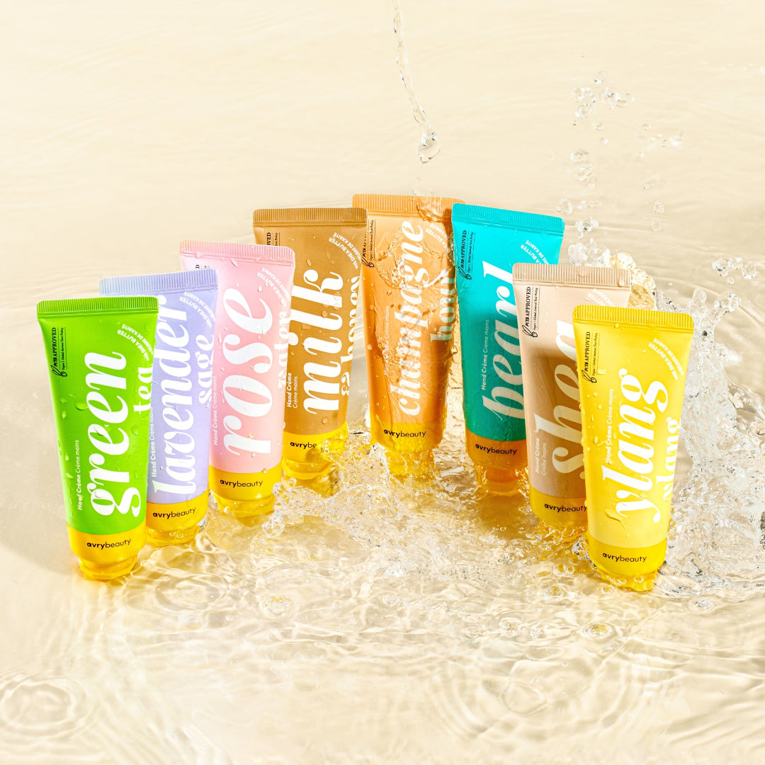 Assorted colorful skincare products with visible brand names in water