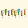 Set of colorful hand lotion tubes with visible brand names on a light background