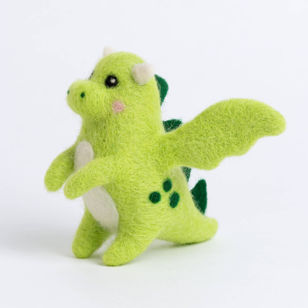 Green plush dragon toy on a white background