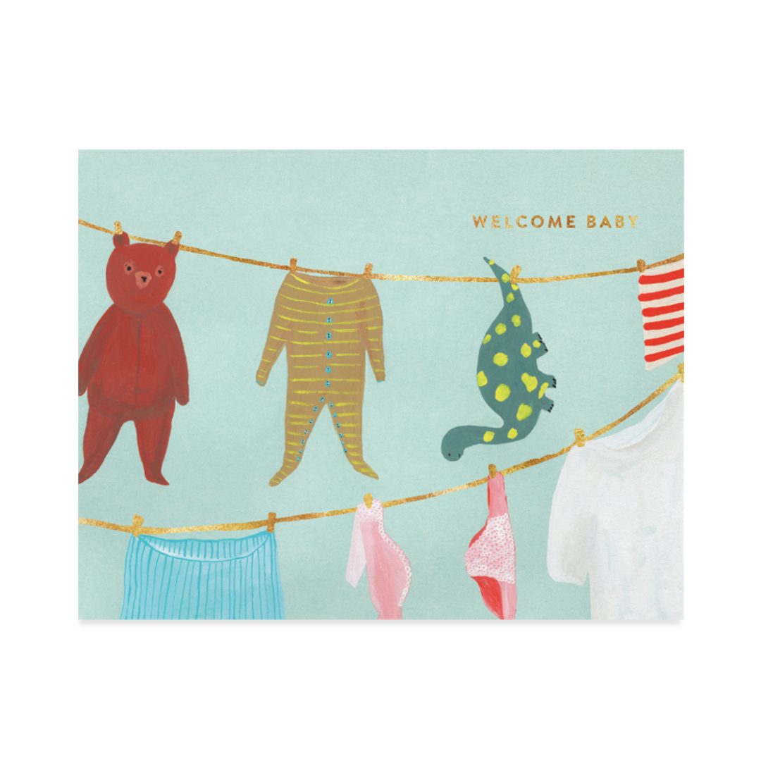 Illustration of baby clothes and toys on a washing line with 'Welcome Baby' text on a light blue background.