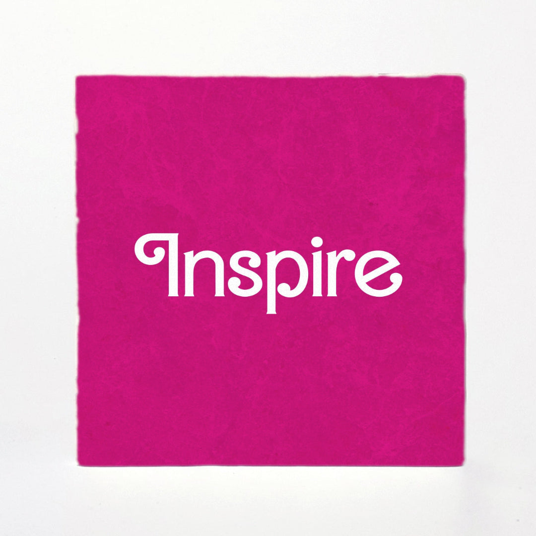 Pink fabric with 'Inspire' text on a white background