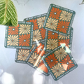 Set of motivational cards with floral design and text on a white surface.