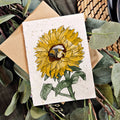 Card with a sunflower illustration on a natural background